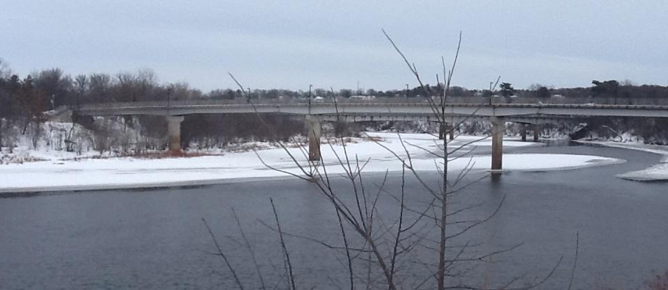 view of bridge over river in winter